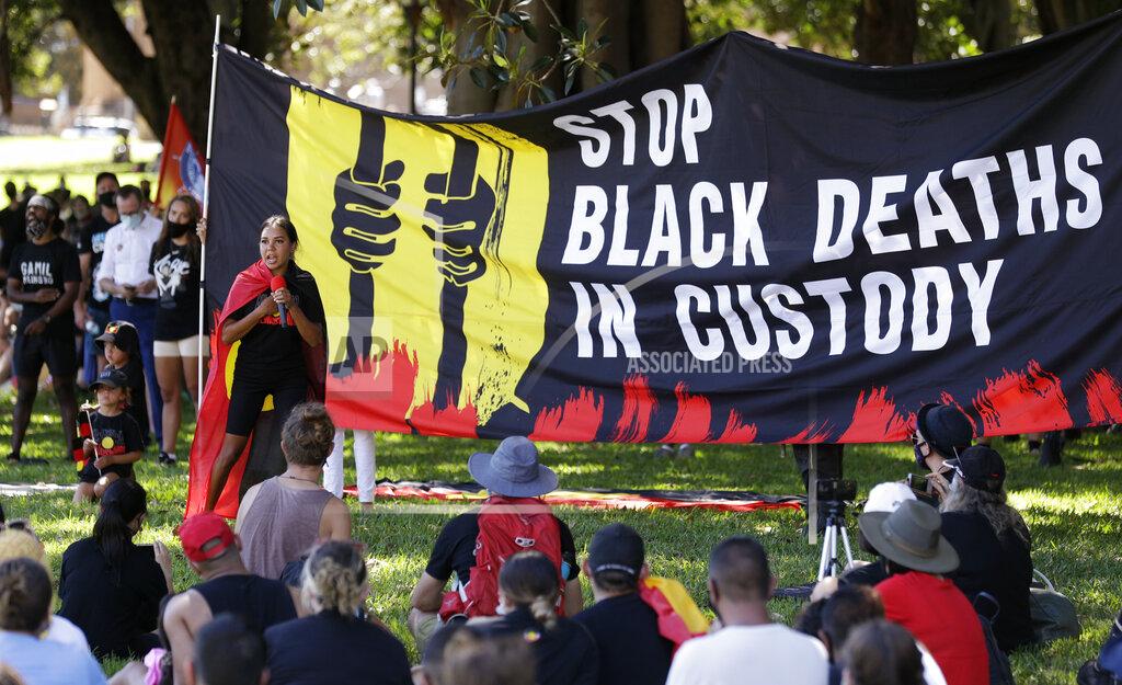Rick Rycroft A speaker addresses a crowd during an Aboriginal-lead Invasion Day rally on Australia Day in Sydney, Tuesday, Jan. 26, 2021. Many of Australia's First Nations people say that sovereignty has never been ceded and oppose ongoing colonial violence and destruction. (AP Photo/Rick Rycroft)