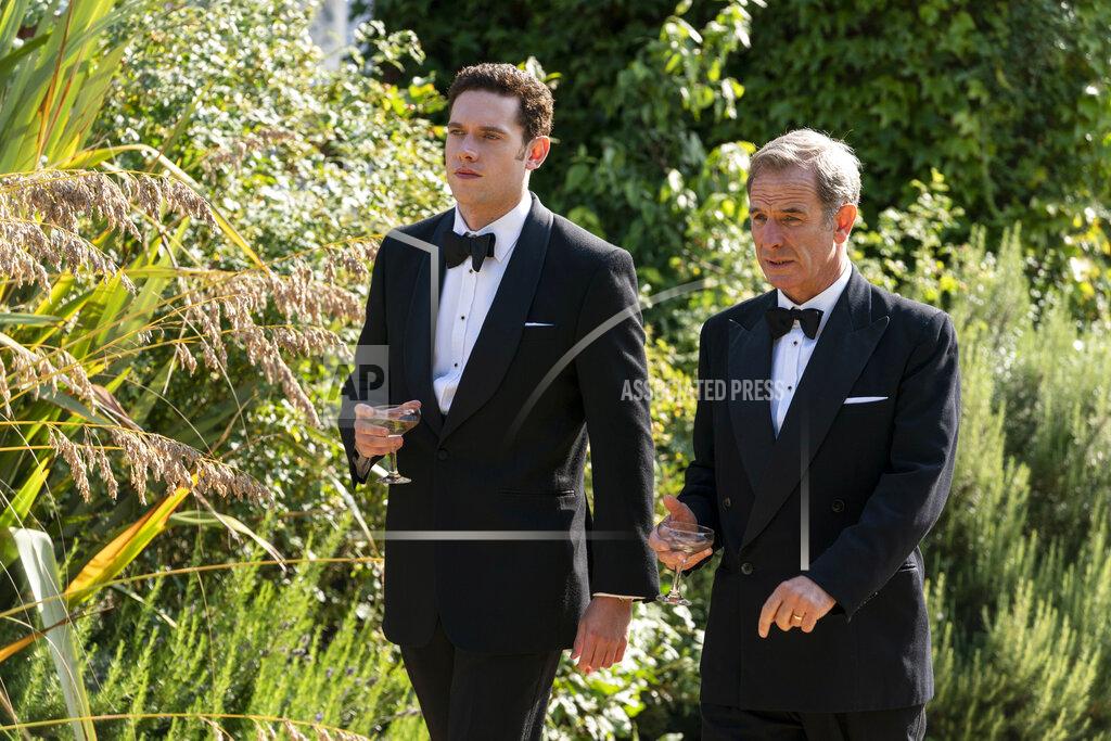 Uncredited This image released by PBS shows Tom Brittney as Will Davenport, left, and Robson Green as Geordie Keating In a scene from "MASTERPIECE Grantchester." Season five premieres on Sunday, June 14. (Kudos/ITV/Masterpiece via AP)