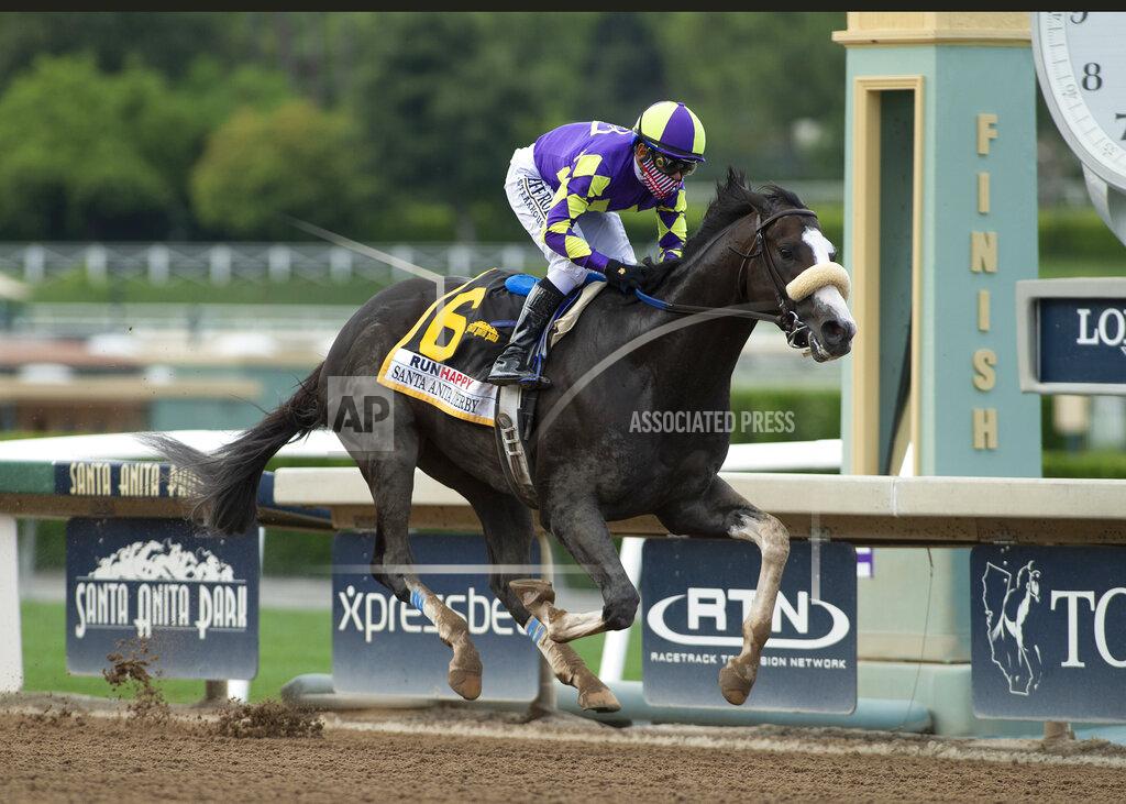 Uncredited In a photo provided by Benoit Photo, C R K Stable's Honor A.P. and jockey Mike Smith win the Grade I $400,000 RUNHAPPY Santa Anita Derby Saturday, June 6, 2020 at Santa Anita Park in Arcadia, Calif.(Benoit Photo via AP)