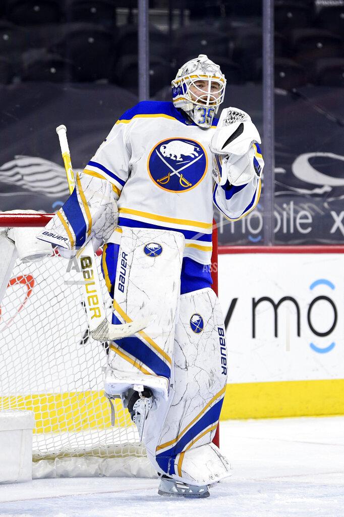Derik Hamilton Buffalo Sabres' Linus Ullmark celebrates after the team's victory against the Philadelphia Flyers, Sunday, April 11, 2021, in Philadelphia. . (AP Photo/Derik Hamilton)
