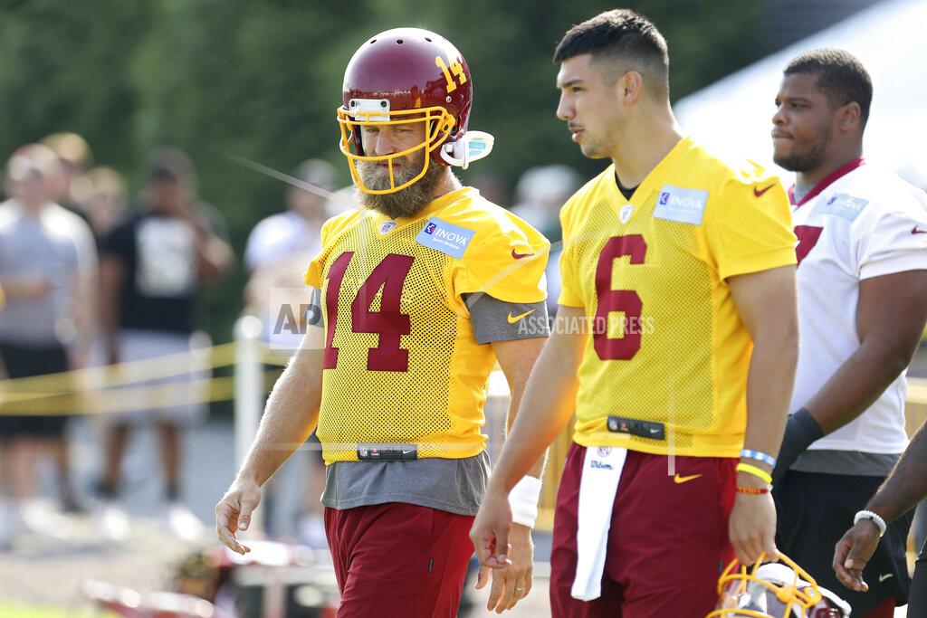 Ryan M. Kelly Washington Football Team quarterbacks Ryan Fitzpatrick (14) and Steven Montez (6) take the field during NFL football practice in Richmond, Va., Wednesday, July 28, 2021. (AP Photo/Ryan M. Kelly)