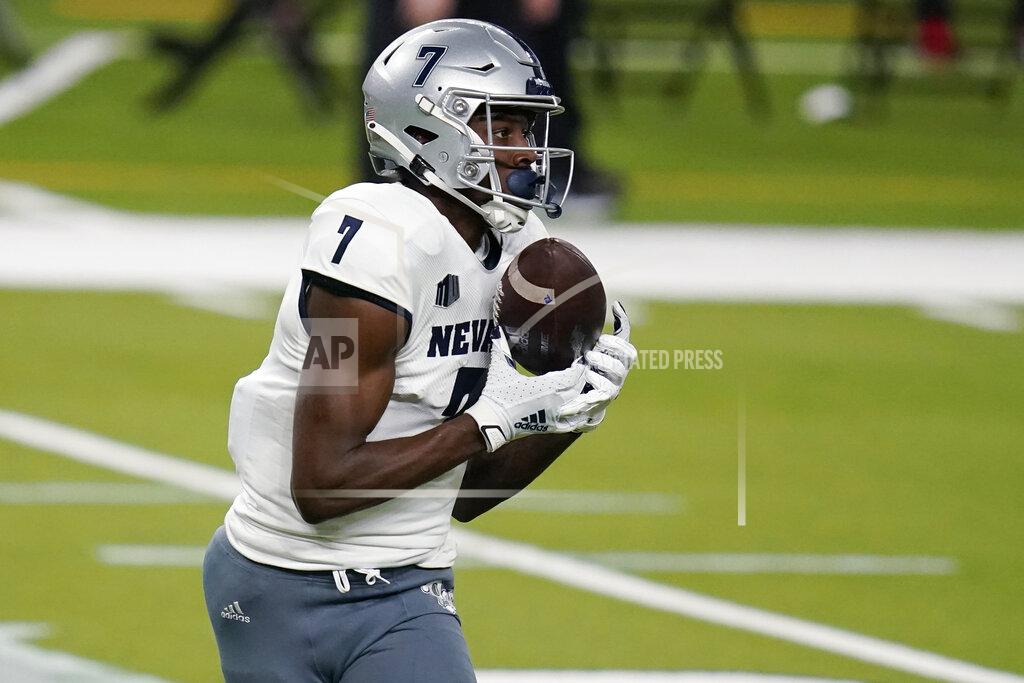 John Locher Nevada wide receiver Romeo Doubs (7) catches a pass for a touchdown against UNLV during the first half of an NCAA college football game Saturday, Oct. 31, 2020, in Las Vegas. (AP Photo/John Locher)