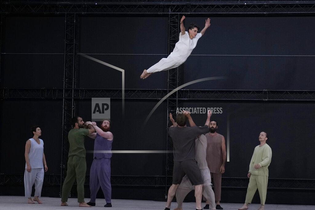 Francois Mori Models wear creations as part of Issey Miyake Homme Plisse men's Spring Summer 2023 collection presented in Paris, France, Thursday, June 23, 2022. (AP Photo/Francois Mori)