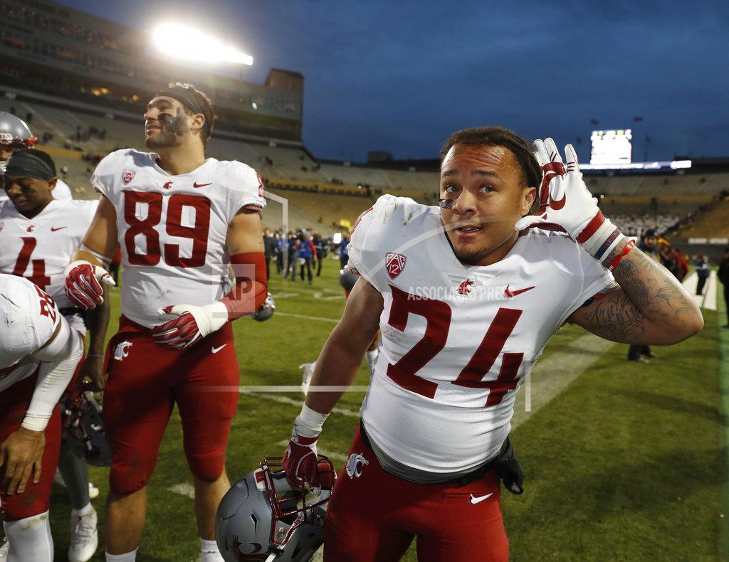 David Zalubowski Washington State running back Keith Harrington gestures to the crowd as his teammates assemble to sing the school song after an NCAA college football game against Colorado Saturday, Nov. 10, 2018, in Boulder, Colo. Washington State won 31-7. (AP Photo/David Zalubowski)