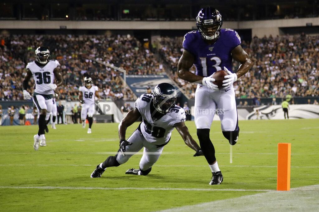 Matt Rourke Baltimore Ravens' Michael Floyd (13) scores a touchdown past Philadelphia Eagles' Jeremiah McKinnon (38) during the first half of a preseason NFL football game Thursday, Aug. 22, 2019, in Philadelphia. (AP Photo/Matt Rourke)