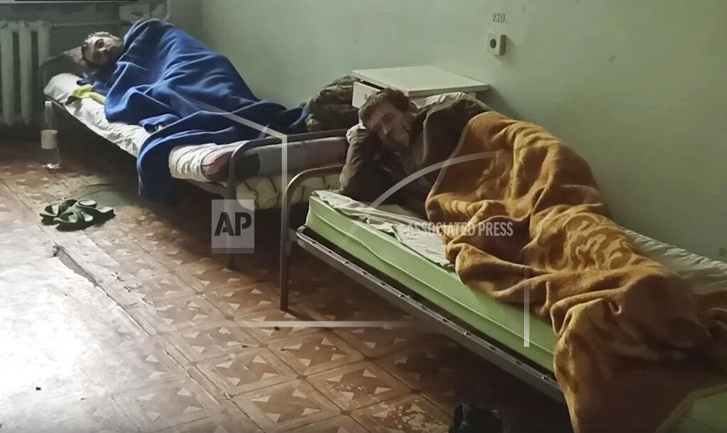 Uncredited In this photo taken from video released by the Russian Defense Ministry on Wednesday, May 18, 2022, shows wounded Ukrainian servicemen lying in a hospital in Novoazovsk, Ukraine, in territory under the government of the Donetsk People's Republic, after they were evacuated from Azovstal steel plant in Mariupol. (Russian Defense Ministry Press Service via AP)