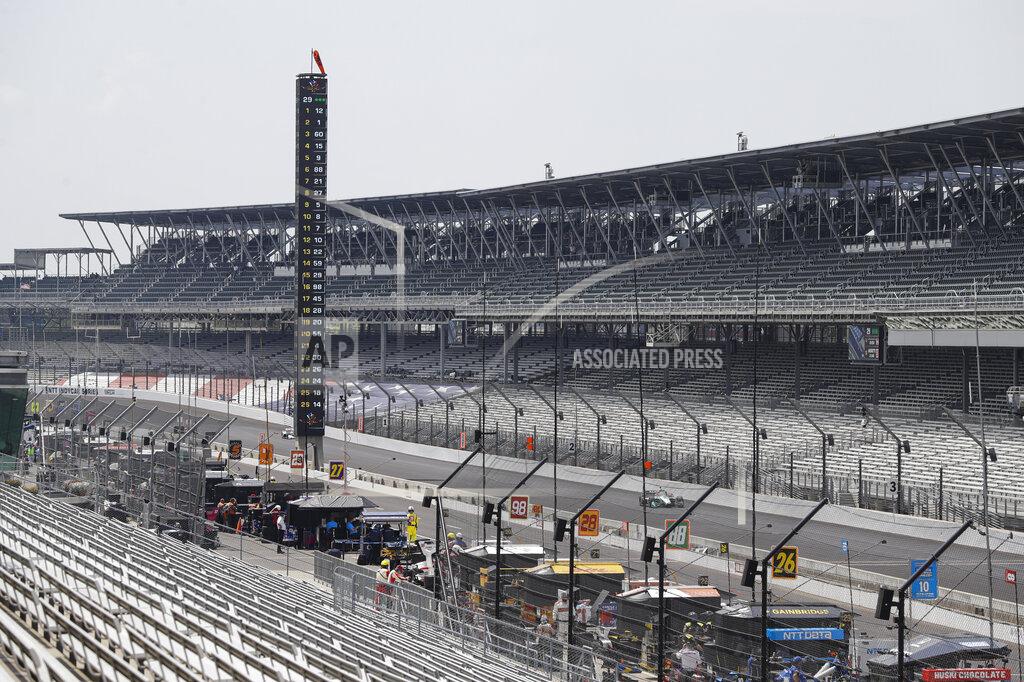 Darron Cummings Race driver Dalton Kellett, of Canada, drives down the main straight in front of empty stands during the IndyCar auto race at Indianapolis Motor Speedway in Indianapolis, Saturday, July 4, 2020. No fans where allowed due to the coronavirus pandemic. (AP Photo/Darron Cummings)