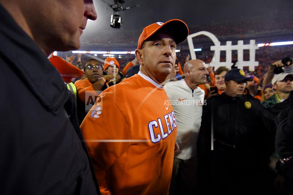 Richard Shiro Clemson head coach Dabo Swinney gathers in the middle of the field after an NCAA college football game against South Carolina Saturday, Nov. 24, 2018, in Clemson, S.C. Clemson won 56-35. (AP Photo/Richard Shiro)