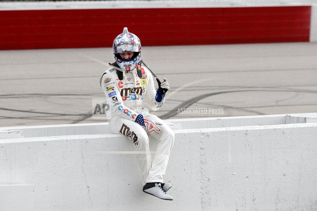 Brynn Anderson Kyle Busch sits on the pit wall after finishing second to Chase Briscoe in the NASCAR Xfinity series auto race Thursday, May 21, 2020, in Darlington, S.C. (AP Photo/Brynn Anderson)