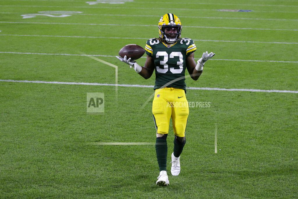Tom Lynn Green Bay Packers' Aaron Jones (33) goes in for a touchdown during the first half of an NFL football game against the Atlanta Falcons, Monday, Oct. 5, 2020, in Green Bay, Wis. (AP Photo/Tom Lynn)