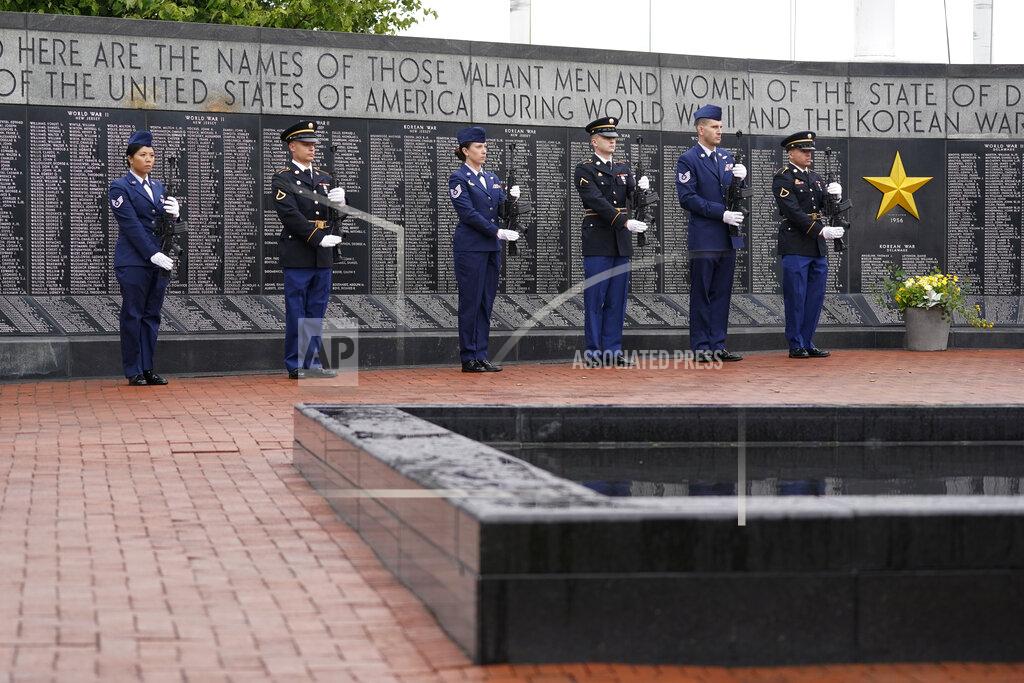 Patrick Semansky An honor guard stands at attention during a Memorial Day event attended by President Joe Biden at Veterans Memorial Park at the Delaware Memorial Bridge in New Castle, Del., Sunday, May 30, 2021. (AP Photo/Patrick Semansky)