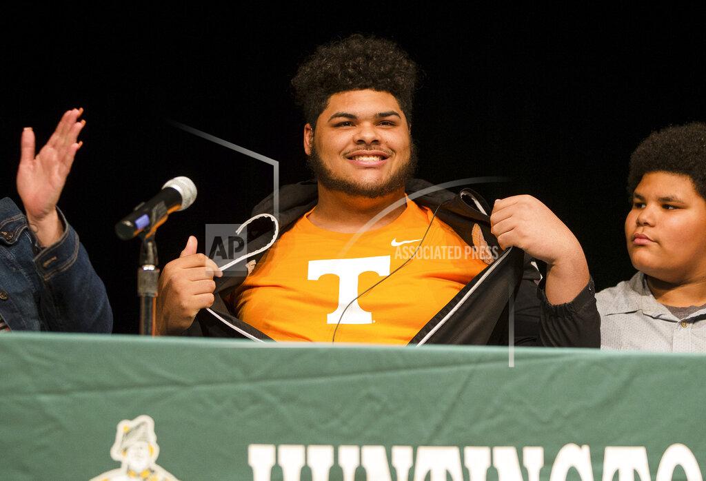 Sholten Singer Darnell Wright reveals he plans to sign a letter of intent to attend and play football at Tennessee, Wednesday, Feb. 6, 2019, at Huntington (W.Va.) High School. (Sholten Singer/The Herald-Dispatch via AP)