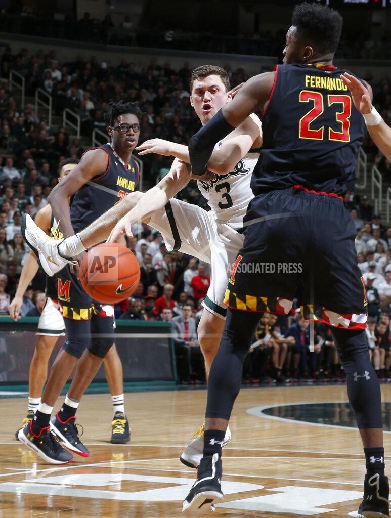 Al Goldis Michigan State's Foster Loyer, center, passes against Maryland's Bruno Fernando (23) during the second half of an NCAA college basketball game, Monday, Jan. 21, 2019, in East Lansing, Mich. Michigan State won 69-55. (AP Photo/Al Goldis)
