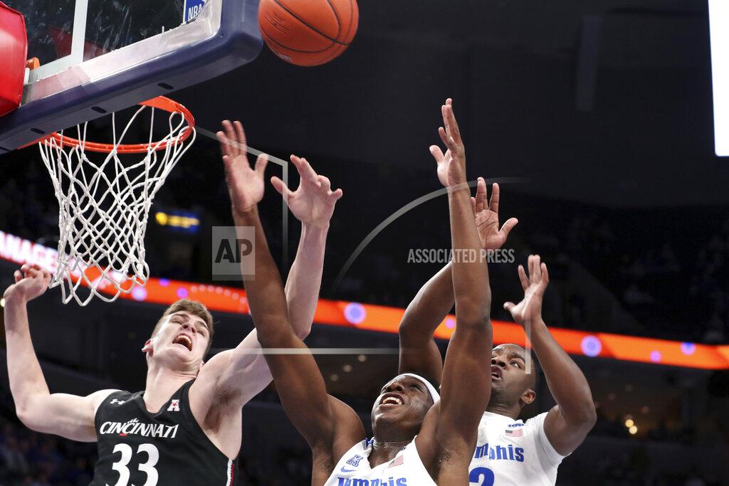 Karen Pulfer Focht Memphis' forward Malcomb Dandridge ( 23) and Cincinnati's center Chris Vogt (33) go up for a rebound in the first half of an NCAA college basketball game Thursday, Jan. 16, 2020, in Memphis, Tenn. (AP Photo/Karen Pulfer Focht)