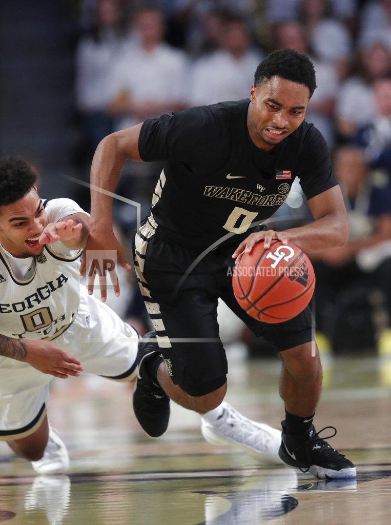 John Bazemore Wake Forest guard Brandon Childress (0) gets past Georgia Tech guard Michael Devoe (0) during the first half of an NCAA college basketball game, Saturday, Jan. 5, 2019, in Atlanta. (AP Photo/John Bazemore)