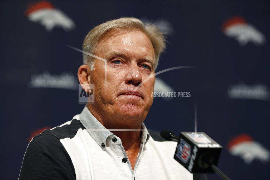 David Zalubowski FILE - In this June 17, 2019 file photo John Elway, general manager of the Denver Broncos, speaks during a news conference at the NFL team's headquarters in Englewood, Colo. Broncos general manager John Elway hasn’t been able to find a worthy successor to Peyton Manning in the four years since his retirement. Elway declared last summer he finally felt good about his QB situation after trading for Joe Flacco and drafting Drew Lock. But Flacco is on IR with a neck injury and Lock has been on IR all year with a sprained thumb and won’t return to practice for a couple of more weeks. (AP Photo/David Zalubowski, File)
