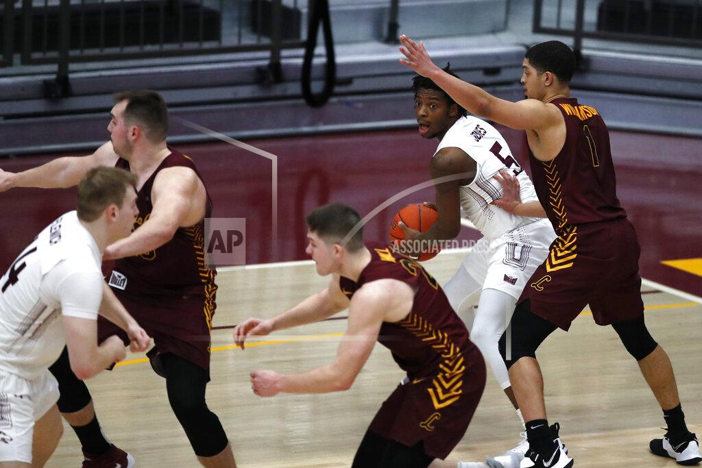 Shafkat Anowar Southern Illinois guard Lance Jones looks to pass through the Loyola Chicago defenders as Lucas Williamson (1) defends during the second half of an NCAA college basketball game Saturday, Feb. 27, 2021, in Chicago. (AP Photo/Shafkat Anowar)