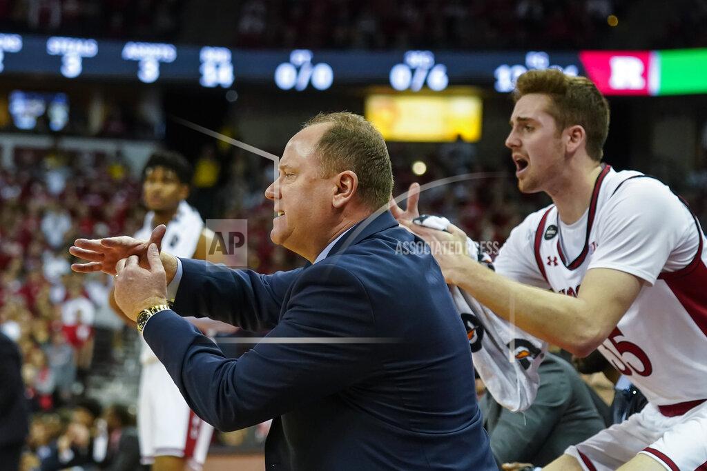 Andy Manis Wisconsin head coach Greg Gard yells for a timeout during the first half of an NCAA college basketball game against Rutgers Sunday, Feb. 23, 2020, in Madison, Wis. Wisconsin won 79-71. At right is Nate Reuvers. (AP Photo/Andy Manis)