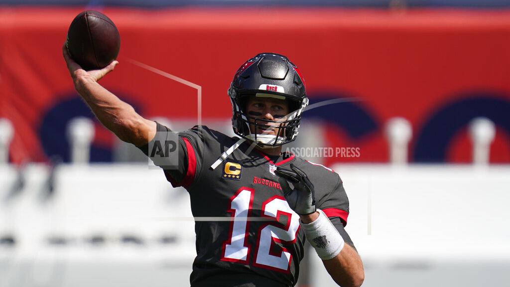 Jack Dempsey Tampa Bay Buccaneers quarterback Tom Brady warms up before an NFL football game against the Denver Broncos, Sunday, Sept. 27, 2020, in Denver. (AP Photo/Jack Dempsey)