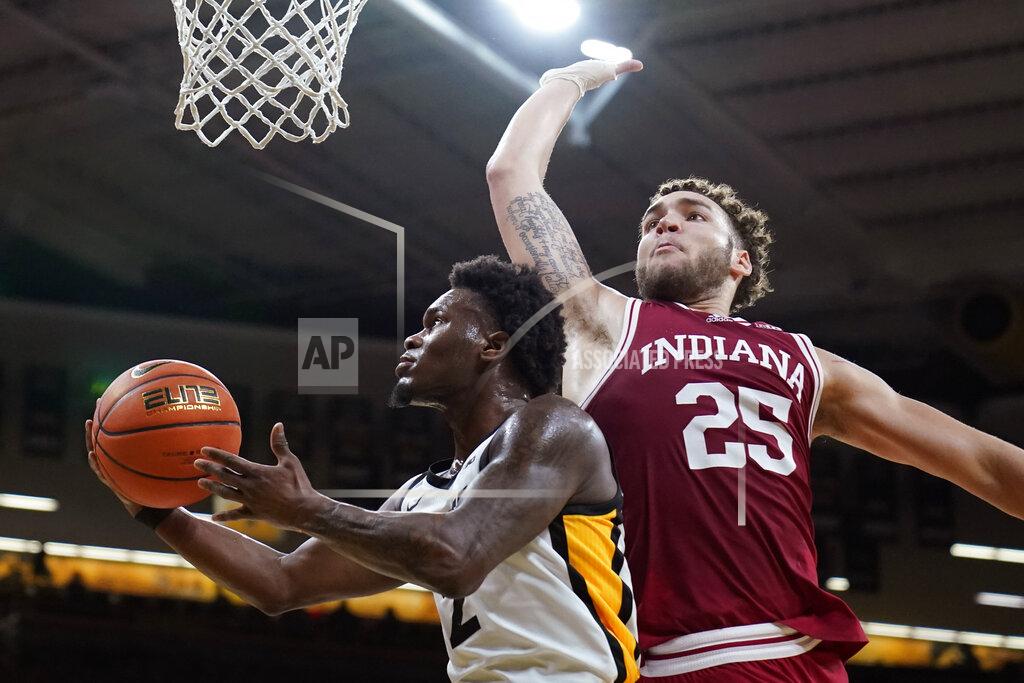 Charlie Neibergall Iowa guard Joe Toussaint drives to the basket past Indiana forward Race Thompson (25) during the second half of an NCAA college basketball game, Thursday, Jan. 13, 2022, in Iowa City, Iowa. (AP Photo/Charlie Neibergall)