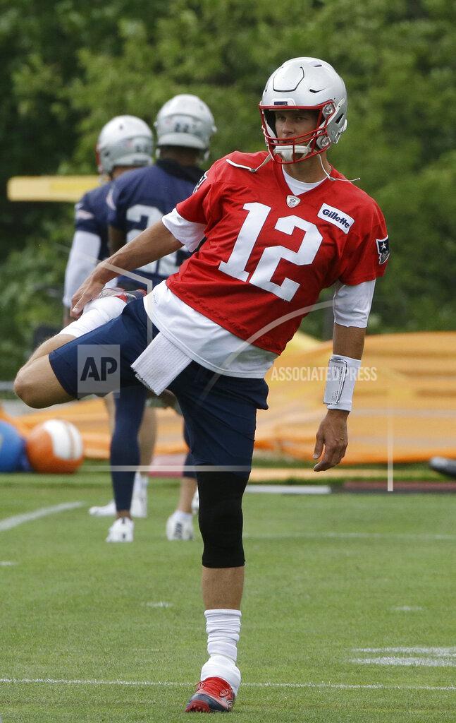 Steven Senne New England Patriots quarterback Tom Brady (12) warms up during an NFL football training camp, Thursday, June 6, 2019, in Foxborough, Mass. (AP Photo/Steven Senne)