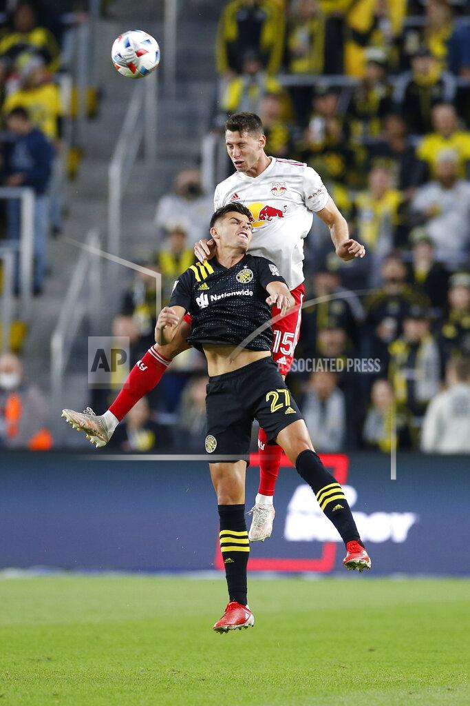 Jay Laprete New York Red Bulls' Sean Nealis, top, and Columbus Crew's Miguel Berry jump for a header during the first half of an MLS soccer match Saturday, Oct. 23, 2021, in Columbus, Ohio. (AP Photo/Jay LaPrete)