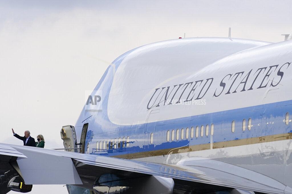 Patrick Semansky President Joe Biden waves as he and first lady Jill Biden board Air Force One at Ellington Field Joint Reserve Base in Houston, Friday, Feb. 26, 2021. The Bidens are en route to Washington. (AP Photo/Patrick Semansky)