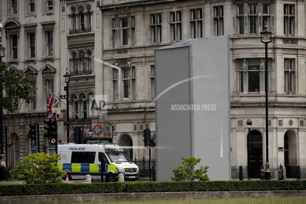 Matt Dunham A protective screen put up late Thursday encloses the statue of Britain's World War II Prime Minister Winston Churchill ahead of expected rival demonstrations by anti-racism and far-right protesters in London, Friday, June 12, 2020. Last Sunday the statue was daubed with the words "was a racist" during a protest against racism and police violence after the May 25 death of George Floyd, a black man who died after a white Minneapolis U.S. police officer pressed a knee to his neck. (AP Photo/Matt Dunham)