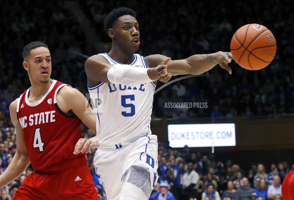 Chris Seward File-This Feb. 16, 2019, file photo shows Duke's RJ Barrett (5) passing the ball against North Carolina State's Jericole Hellems (4) during the second half of an NCAA college basketball game in Durham, N.C. Barrett leads the Atlantic Coast Conference in scoring. He just recorded Duke’s first triple-double in 13 years. And as long as his roommate Zion Williamson is still around, he won’t have top-billing for the top-ranked Blue Devils.
That’s just fine with Barrett. (AP Photo/Chris Seward, File)