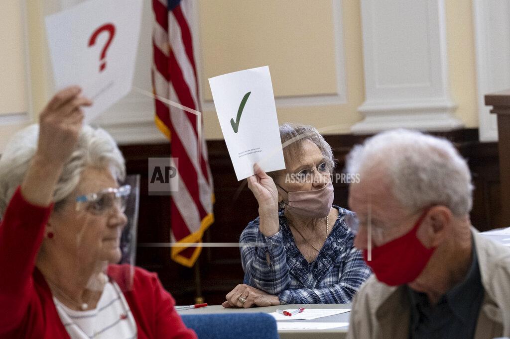 Ben Gray Officials sort ballots during an audit at the Floyd County administration building in Rome, Ga., on Friday morning, Nov. 13, 2020. Election officials in Georgia’s 159 counties are undertaking a hand tally of the presidential race that stems from an audit required by state law. (AP Photo/Ben Gray)