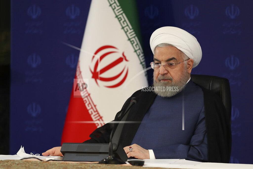 Uncredited In this photo released by the official website of the office of the Iranian Presidency, President Hassan Rouhani attends a meeting of the national headquarters of the fight against the COVID-19, in Tehran, Iran, Saturday, July 18, 2020. He estimated as many as 25 million Iranians could have been infected with the coronavirus since the outbreak's beginning, citing an Iranian Health Ministry study that has so far not been made public, the state-run IRNA news agency reported. Writing in Farsi at top right reads, "The Presidency." (Iranian Presidency Office via AP)
