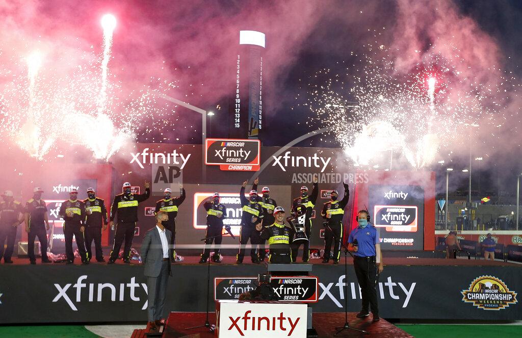 Ralph Freso Austin Cindric, center, celebrates in victory lane after winning the season championship and the NASCAR Xfinity Series auto race at Phoenix Raceway, Saturday, Nov. 7, 2020, in Avondale, Ariz. (AP Photo/Ralph Freso)