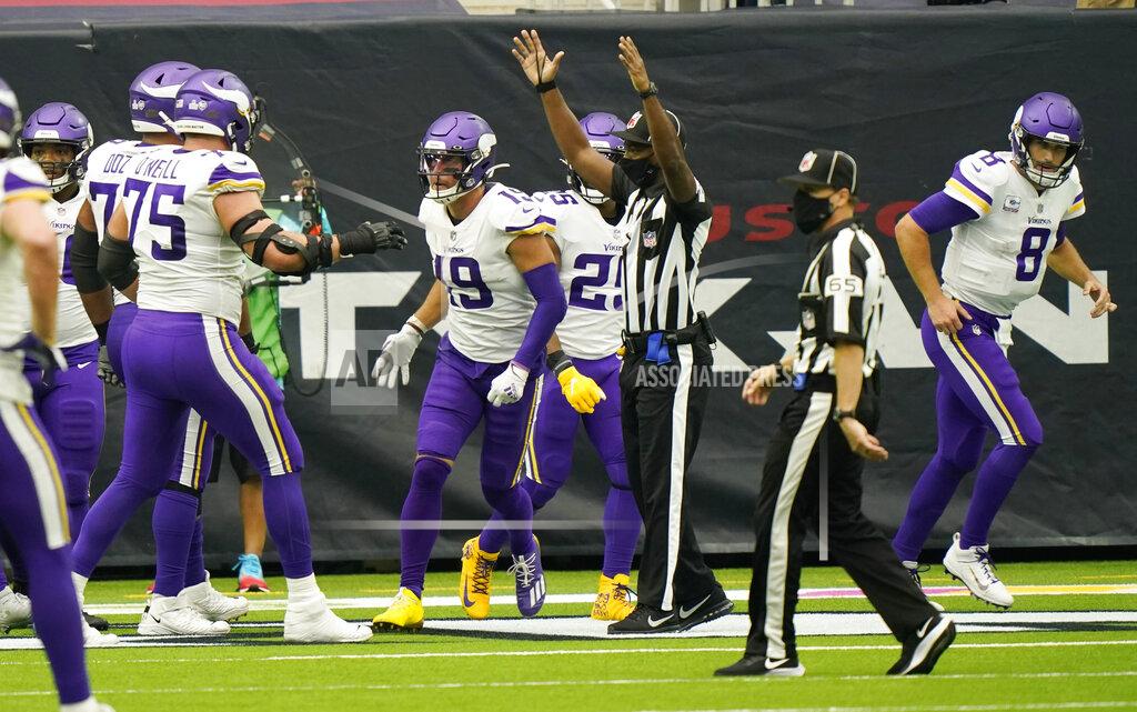 David J. Phillip Minnesota Vikings wide receiver Adam Thielen (19) and quarterback Kirk Cousins (8) celebrates after they connected on a pass for a touchdown against the Houston Texans during the second half of an NFL football game Sunday, Oct. 4, 2020, in Houston. (AP Photo/David J. Phillip)