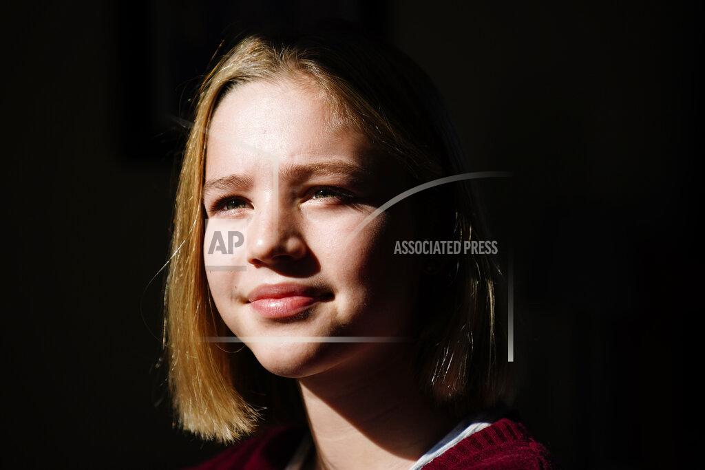 Matt Rourke Rebekah Bruesehoff, 14, poses for a portrait in New Jersey, Friday, Feb. 26, 2021. “I know what it’s like to have my gender questioned,” the transgender teenager said. “It’s invasive, embarrassing. I don’t want others to go through that.” (AP Photo/Matt Rourke)