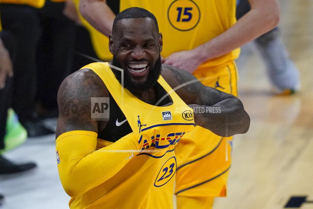 Brynn Anderson Los Angeles Lakers forward LeBron James walks onto the court for the first half of basketball's NBA All-Star Game in Atlanta, Sunday, March 7, 2021. (AP Photo/Brynn Anderson)