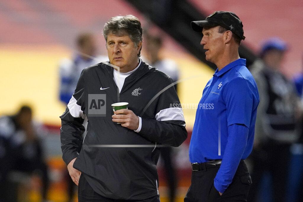 Rick Scuteri Washington State coach Mike Leach, left, and Air Force coach Troy Calhoun talk before the Cheez-It Bowl NCAA college football bowl game, Friday, Dec. 27, 2019, in Phoenix. (AP Photo/Rick Scuteri)