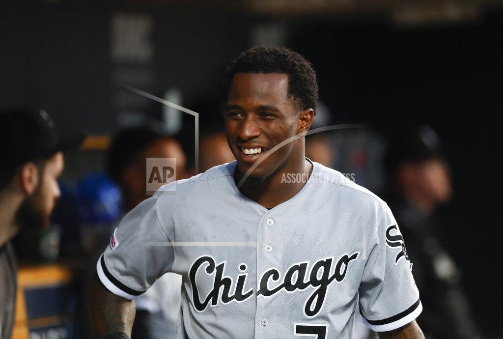 Paul Sancya FILE - In this Sept. 20, 2019, file photo, Chicago White Sox's Tim Anderson smiles in the dugout during the second inning of the team's baseball game against the Detroit Tigers in Detroit. Anderson landed a spot on a video game cover Thursday, Jan.21. He'd like a World Series ring to go with it. Anderson sees no reason why the White Sox can't win it all after loading up on the heels of a breakthrough playoff season. (AP Photo/Paul Sancya, File)