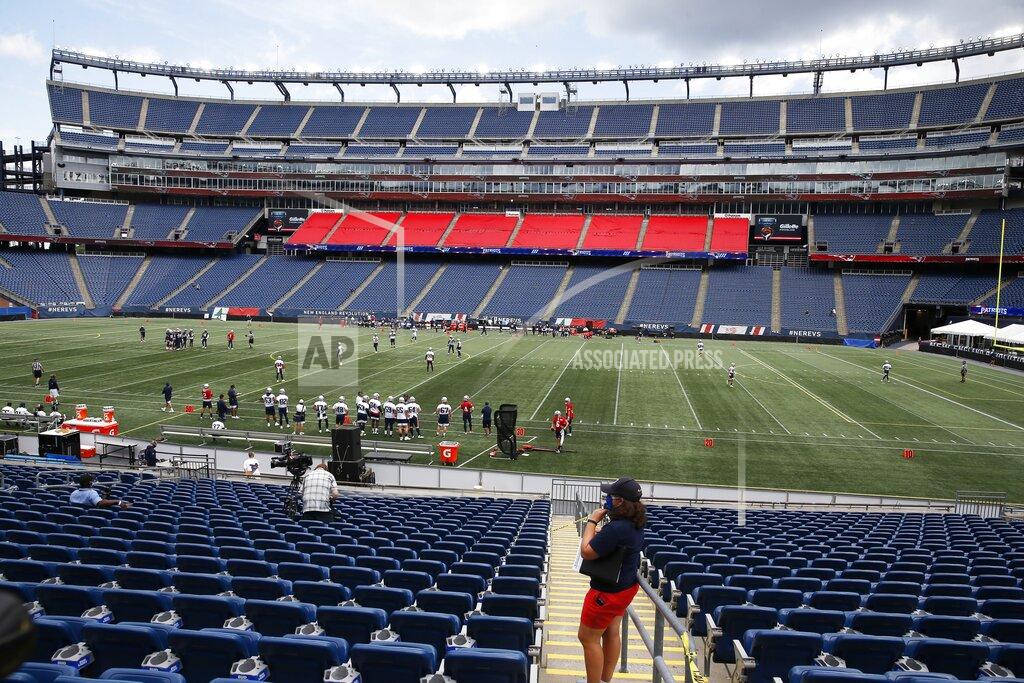 Michael Dwyer The New England Patriots take the field at Gillette Stadium for an NFL football training camp scrimmage, Friday, Aug. 28, 2020, in Foxborough, Mass. (AP Photo/Michael Dwyer, Pool)