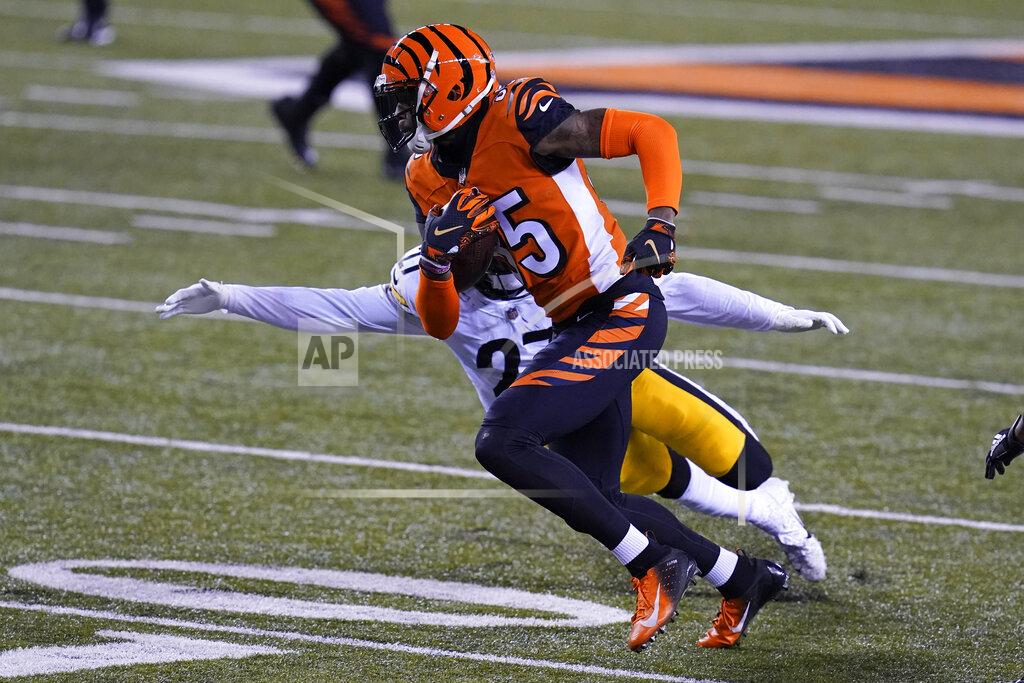 Michael Conroy Cincinnati Bengals' Tee Higgins (85) runs past Pittsburgh Steelers' Marcus Allen (27) during the first half of an NFL football game, Monday, Dec. 21, 2020, in Cincinnati. (AP Photo/Michael Conroy)