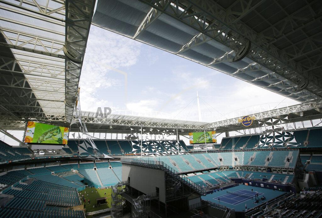 Lynne Sladky The Miami Open tennis tournament's center court is viewed at Hard Rock Stadium, Monday, March 18, 2019, in Miami Gardens, Fla. The Miami Open has moved north from its home since 1987, the picturesque island of Key Biscayne, and will begin Tuesday at the home of the Miami Dolphins and Miami Hurricanes. (AP Photo/Lynne Sladky)