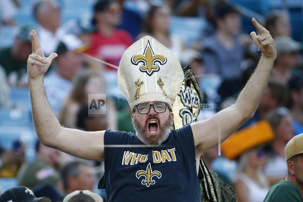 Stephen B. Morton A New Orleans Saints fan cheers during the second half of an NFL football game between the New Orleans Saints and the Green Bay Packers, Sunday, Sept. 12, 2021, in Jacksonville, Fla. (AP Photo/Stephen B. Morton)