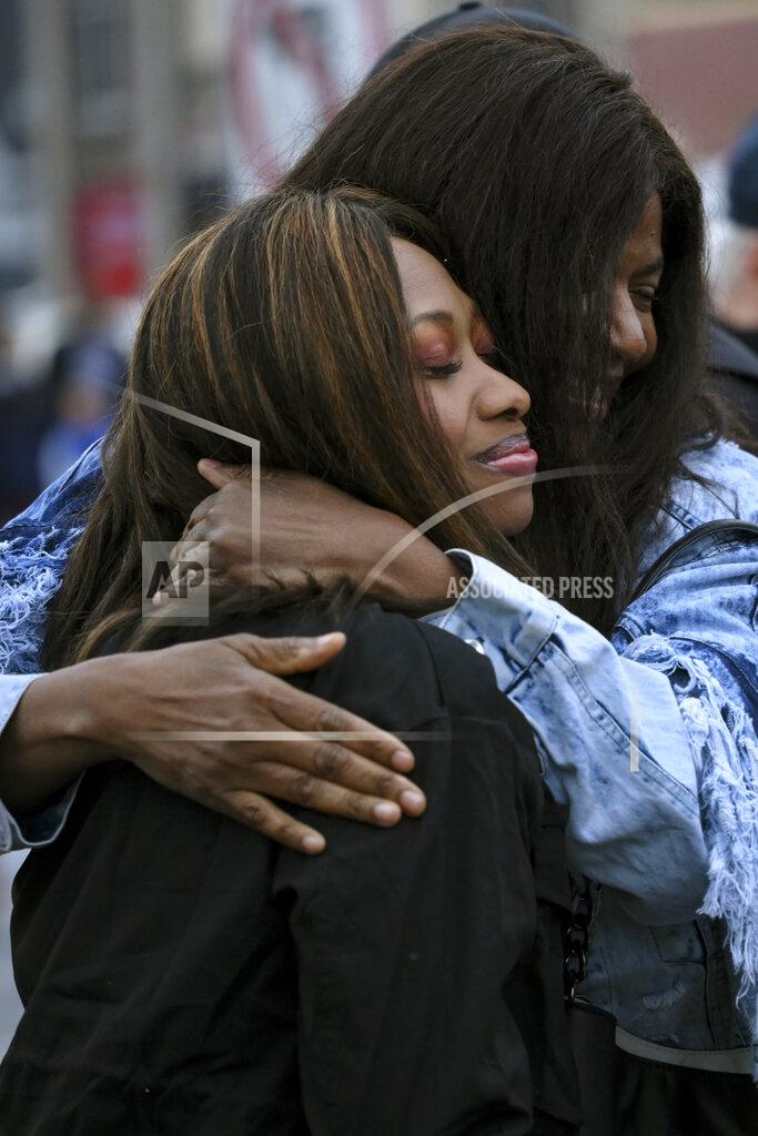 Aaron Lavinsky Paris Stevens, cousin of George Floyd, left, embraces Angela Harrelson, Floyd's aunt, at George Floyd Square Wednesday, May 25, 2022, in Minneapolis. The intersection where Floyd died at the hands of Minneapolis police officers was renamed in his honor Wednesday, among a series of events to remember a man whose killing forced America to confront racial injustice. (Aaron Lavinsky/Star Tribune via AP)