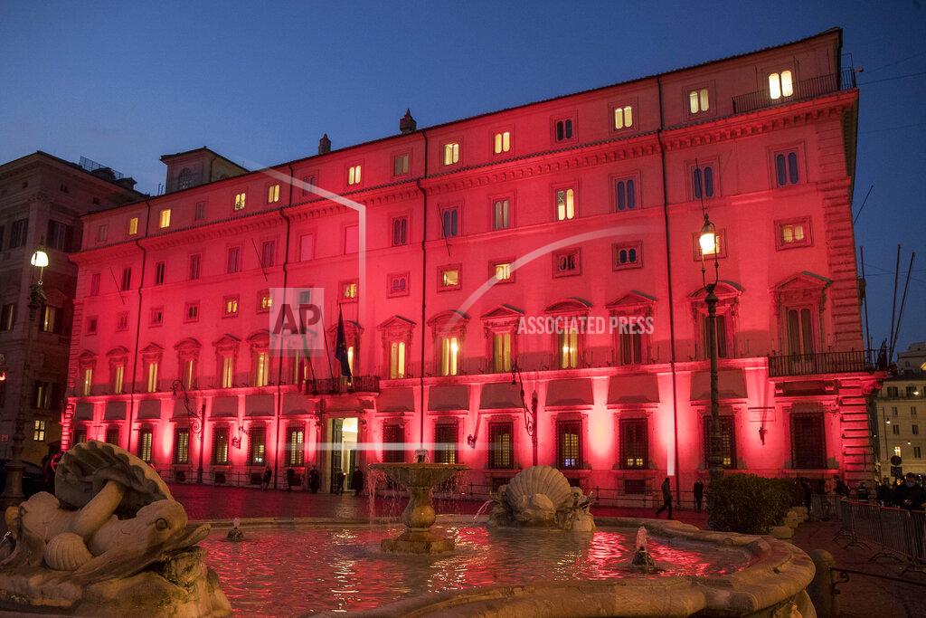 Roberto Monaldo Chigi Palace Italian government's office is illuminated in red on the occasion of International Day for the Elimination of Violence against Women, in Rome, Wednesday, Nov. 25, 2020. (Roberto Monaldo/LaPresse via AP)