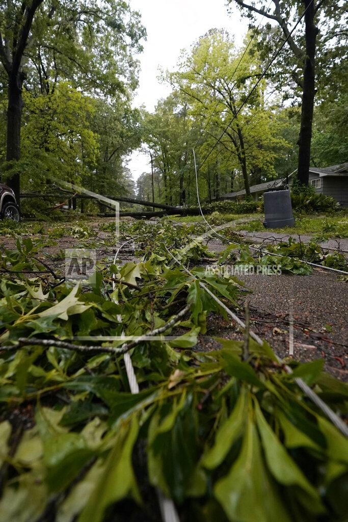 Rogelio V. Solis Tree branches mix with downed utility lines in this northeast Jackson, Miss., neighborhood, following a bout of high winds and severe weather, Tuesday afternoon, May 4, 2021. The severe weather was not unexpected, since the state was hit with a number of tornadoes on Sunday. (AP Photo/Rogelio V. Solis)