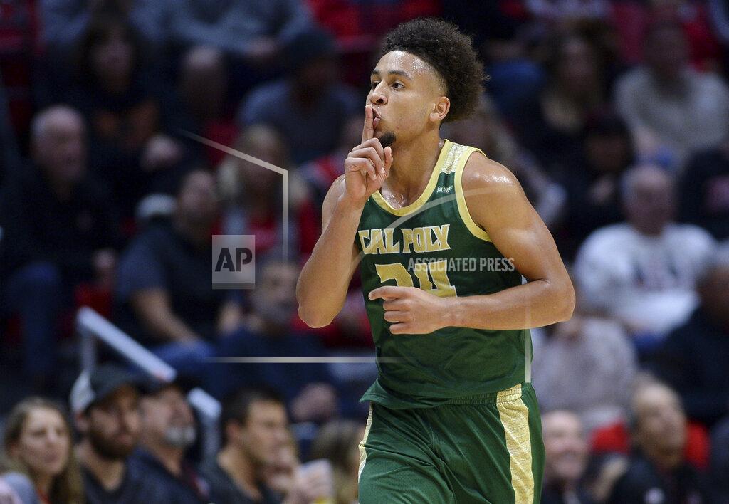 Orlando Ramirez Cal Poly guard Junior Ballard gestures toward the crowd after a 3-point basket during the first half of the team's NCAA college basketball game against San Diego State on Saturday, Dec. 28, 2019, in San Diego. (AP Photo/Orlando Ramirez)