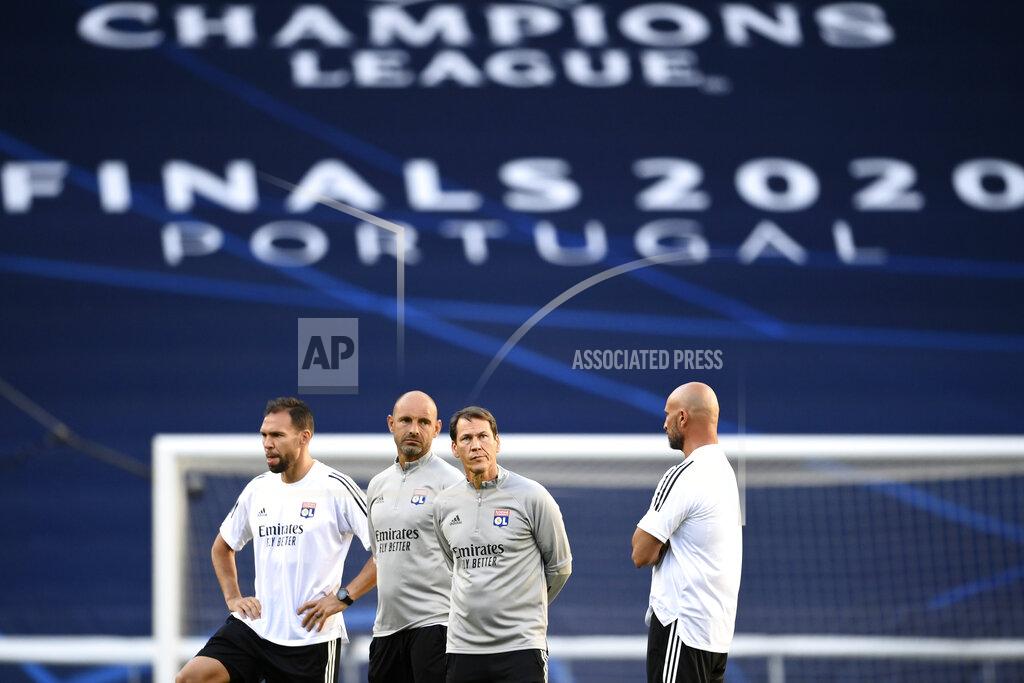 Franck Fife Lyon's head coach Rudi Garcia, 2nd right, directs a training session at the Jose Alvalade stadium in Lisbon, Friday Aug. 14, 2020. Lyon will play Manchester City in a Champions League quarterfinals soccer match on Saturday. (Franck Fife/Pool via AP)