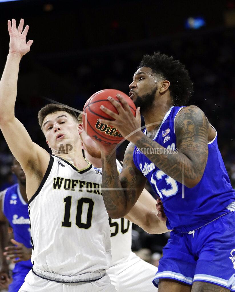 John Raoux Seton Hall's Myles Powell, right, goes up for shot past Wofford's Nathan Hoover (10) during the first half of a first-round game in the NCAA men’s college basketball tournament in Jacksonville, Fla., Thursday, March 21, 2019. (AP Photo/John Raoux)
