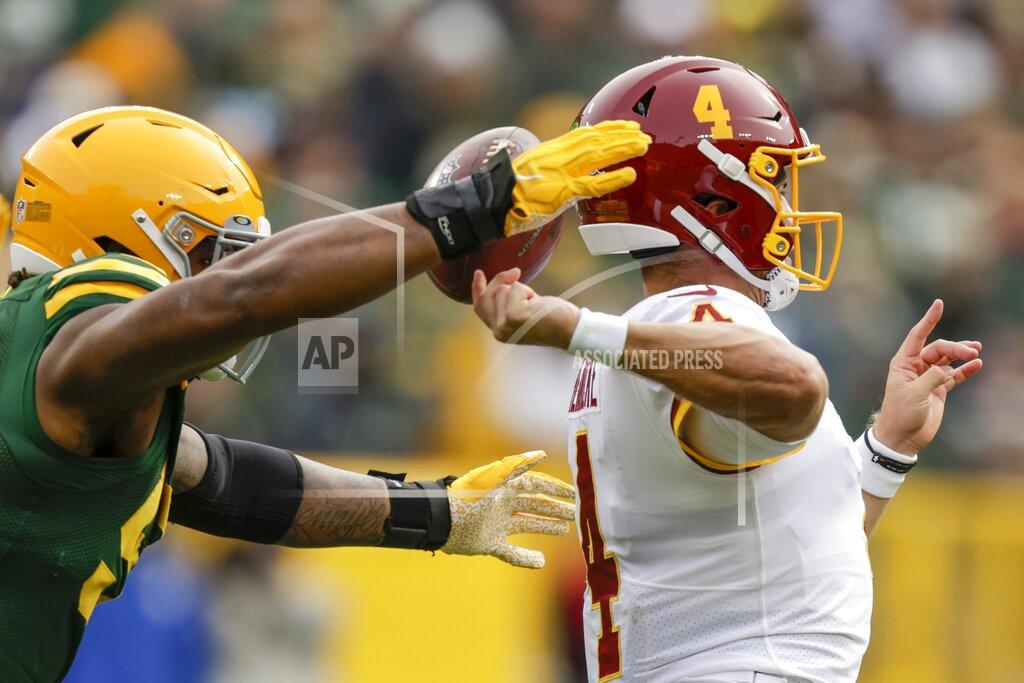 Matt Ludtke Green Bay Packers' Rashan Gary knocks the ball from Washington Football Team's Taylor Heinicke during the second half of an NFL football game Sunday, Oct. 24, 2021, in Green Bay, Wis. The Packers recovered the fumble. (AP Photo/Matt Ludtke)