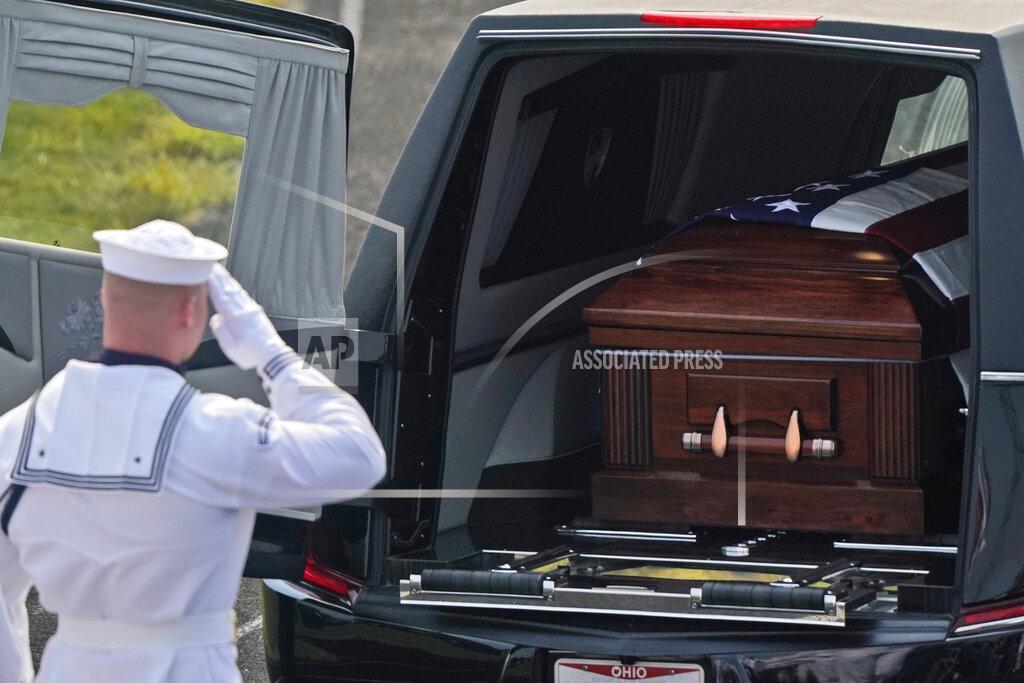 Tony Dejak A member of the U.S. Navy Honor Guard gives a final salute to Navy Corpsman Maxton Soviak at Edison High School Stadium, Monday, Sept. 13, 2021, in Milan, Ohio. Soviak was one of 13 U.S. troops killed in a suicide bombing at Afghanistan's Kabul airport on Aug. 26. (AP Photo/Tony Dejak)