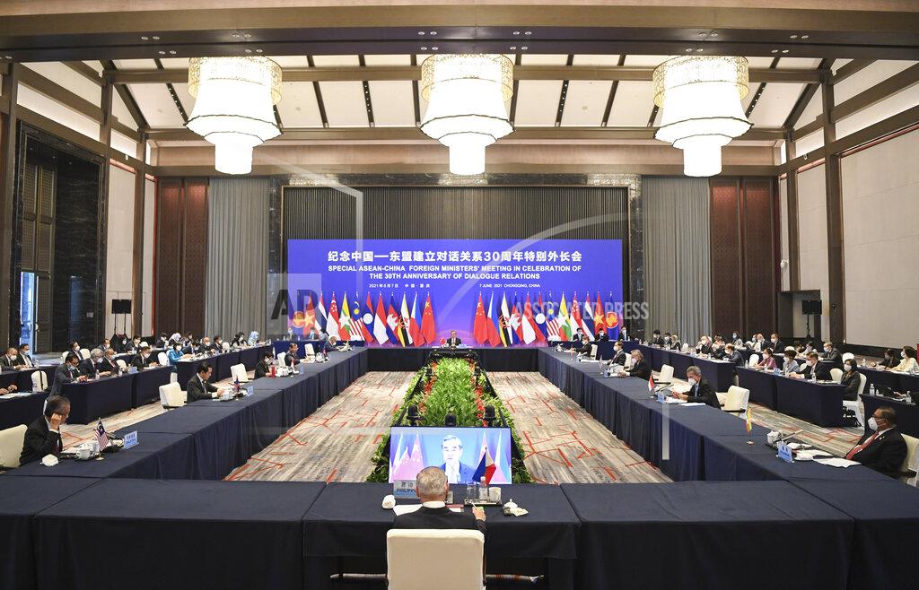 Wang Quanchao In this photo released by Xinhua News Agency, a special ASEAN-China Foreign Ministers' Meeting in Celebration of the 30th Anniversary of Dialogue Relations co-chaired by Chinese State Councilor and Foreign Minister Wang Yi and Teodoro Locsin, foreign secretary of the Philippines that serves as the current country coordinator for ASEAN-China relations and attended by foreign ministers from ASEAN countries held in Chongqing, southwestern China, June 7, 2021. China is hosting foreign ministers from 10 Southeast Asian nations this week in the southwestern megacity of Chongqing amid heightened competition between Beijing and Washington for influence in the region. (Wang Quanchao/Xinhua via AP)
